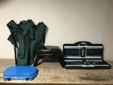 A folding portable picnic table bench set together with folding chairs and two gas stoves