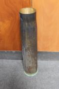 A large brass ammunition shell