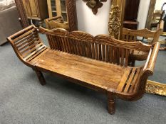 An Indonesian hardwood three seater bench,