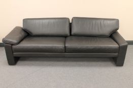 A black leather settee CONDITION REPORT: One armrest cushion missing.