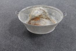 A galvanised twin handled wash tub
