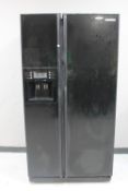 A Samsung double door fridge with water dispenser