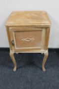 A pine pot cupboard on cabriole legs