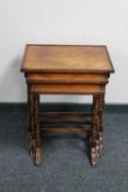 A nest of three mahogany tables