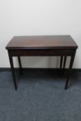 A George III mahogany turnover top tea table