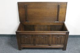 An oak linen fold blanket box