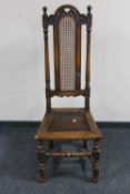 A carved oak high back hall chair