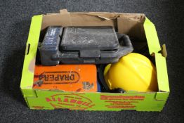 A box containing hard hat,