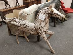 A teak garden figure - horse,