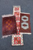 Four small Iranian rugs