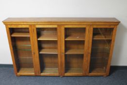 An Edwardian glazed oak four door bookcase