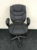 A contemporary swivel office armchair
