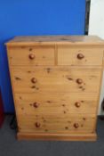 A pine five drawer chest