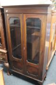 An Edwardian double door bookcase