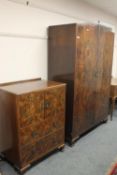 A walnut double door wardrobe, matching dressing chest,