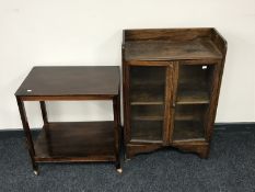 An Edwardian glazed door bookcase and a tea trolley