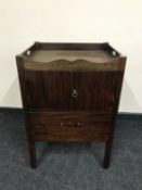 A 19th century mahogany double door pot cupboard
