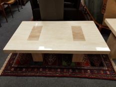 A contemporary high-gloss granite coffee table,