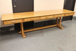 An oak five drawer library table,