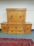 An oriental style carved, high gloss breakfront entertainment cabinet fitted cupboards and drawers,