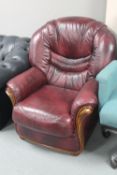 A Burgundy leather armchair