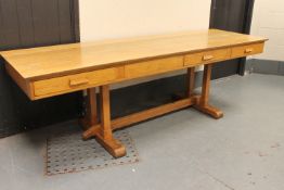 An oak four drawer library table,