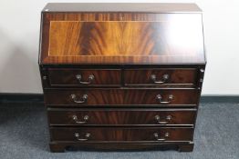 An inlaid mahogany Regency style bureau