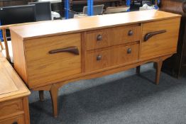 A 20th century teak low sideboard