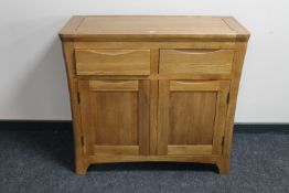 A contemporary oak double door sideboard