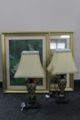 A pair of gilt framed lithographic prints and a pair of table lamps