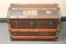 An early 20th century domed topped shipping trunk
