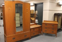 A 1930's oak three piece bedroom suite