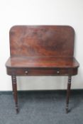 A George III foldover tea table fitted a drawer