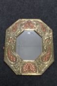 A copper and brass octagonal Arts & Crafts framed mirror
