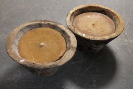 Two candles in wooden pots