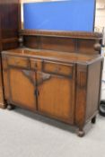 A 1930's oak buffet back sideboard