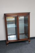 A double door mahogany display cabinet