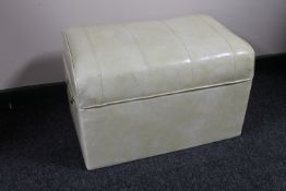 A mid 20th century cream vinyl storage footstool