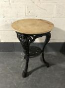 A cast iron Britannia bar table base