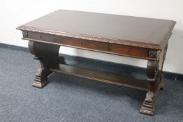 An early 20th century oak library table fitted three drawers