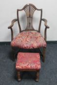 An antique oak Hepplewhite style armchair and an oak footstool