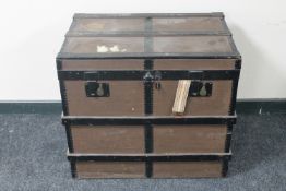 A wooden bound shipping trunk