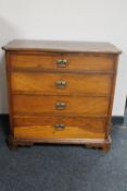 A late 19th century oak shaped front four drawer chest