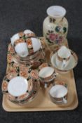 A Victorian hand painted opaque glass vase together with thirty-six pieces of antique tea china