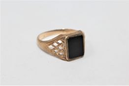 A 9ct gold signet ring set with black onyx CONDITION REPORT: 2.9g.