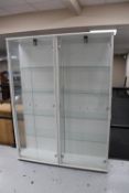 A pair of double door display cabinets
