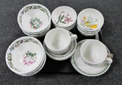A tray containing sixteen Portmeirion bowls together with two oversized Portmeirion teacups with