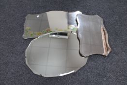 Three early 20th century frameless bevelled mirrors