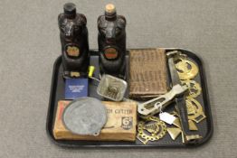 A tray of vintage glass Vodka bottles, 1950's pastry cutters, brass, balance arm etc.