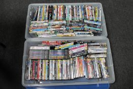Two large plastic storage crates with lids containing a quantity of DVD's